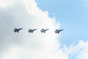 A group of warplanes flying at the blue sky