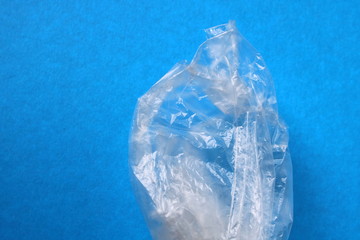 Fototapeta premium the package is transparent on a blue background, empty space,