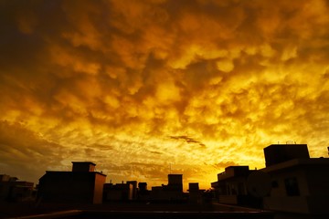 beauiful view of yellow clouds during sunset in india