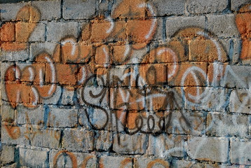 graffiti on brick wall