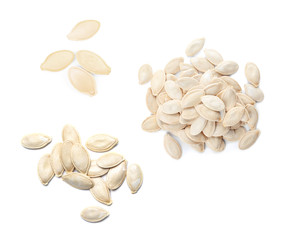 Set of raw pumpkin seeds on white background, top view