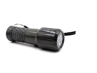 A black flashlight isolated on white background