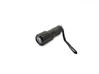 A black flashlight isolated on white background
