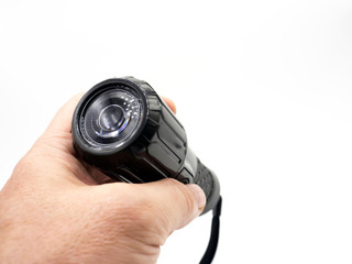 hand holding black flashlight isolate on white background
