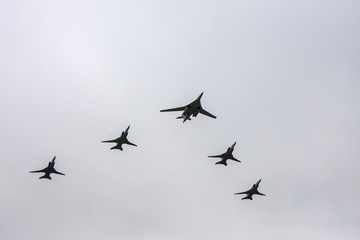 Fototapeta na wymiar Combat aircraft fly in formation on May 9 Victory Parade