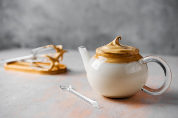 Dalgona Coffee in glass pot,Korean trendy home made coffee, a drink in isolation at home