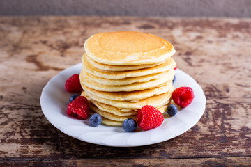 Stack of homemade pancakes berries. Typical American breakfast or snack.