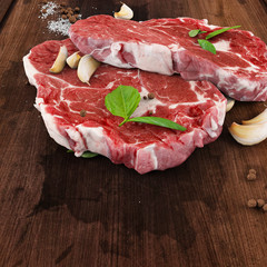 raw meat on wooden board