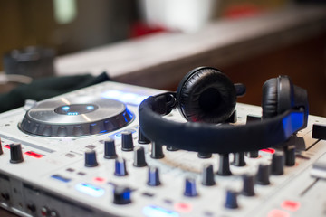 Fototapeta na wymiar DJ headphone on turn table mixing