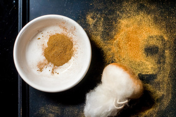 Golden powder on black background