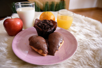 details of a full breakfast with juice, milk and croissants