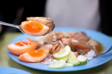 Slice red boil egg crispy pork chinese style with rice