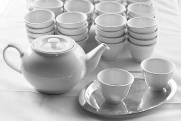Set of white chinese vintage ceramic teapot and cup of tea