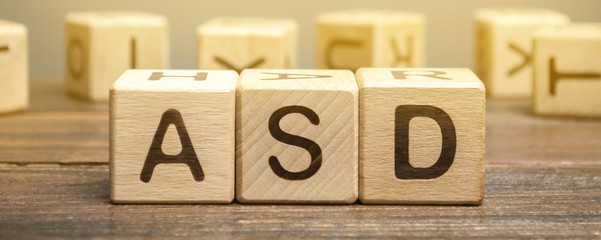 Wooden blocks with the word ASD - Autism Spectrum Disorder. Neurological and developmental disorder