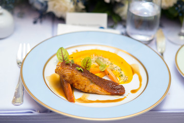 French food - Grilled fillet salmon eat with carrot sauce