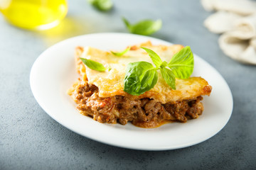 Traditional homemade lasagna with fresh basil