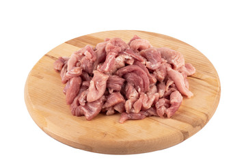 Chopped pork on a cutting board over a white background.