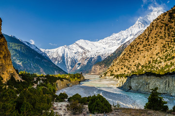 Kali Gandaki valley near Tukuche village with Mt. Dhaulagiri on the horizon. Annapurna circuit / Jomsom trek, Nepal.