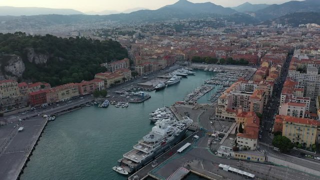 Beautiful shot of a flight over the port of Nice in France. Aerial photography of the Cote d'azur with parked yachts.