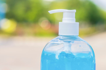 Hand sanitizer gel prevent the spread of the corona virus COVID-19 on bokeh background. Health care concept