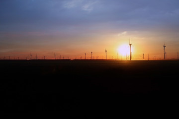 Silhouette of the pinwheel wind field during the sunset with long shot in North Carolina, NC. USA.