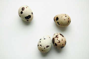 Quail eggs pattern. Big collection of quail eggs on white background. Easter concept. Flat lay, top view, copy space