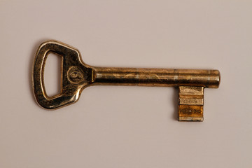 The old mechanical lock key used in the interior doors of the houses. Mechanical lock switch. Key made of brass.