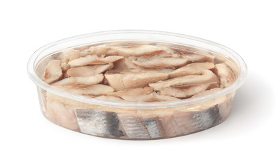 Slices of pickled herring in plastic container