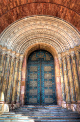 Fototapeta premium One of the many beautiful doors of Cuenca's Cathedral, made with stone and marble and with stunning arches. Cuenca, Ecuador, South America.
