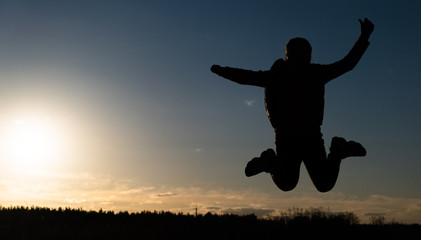 Fototapeta na wymiar silhouette of jumping girl