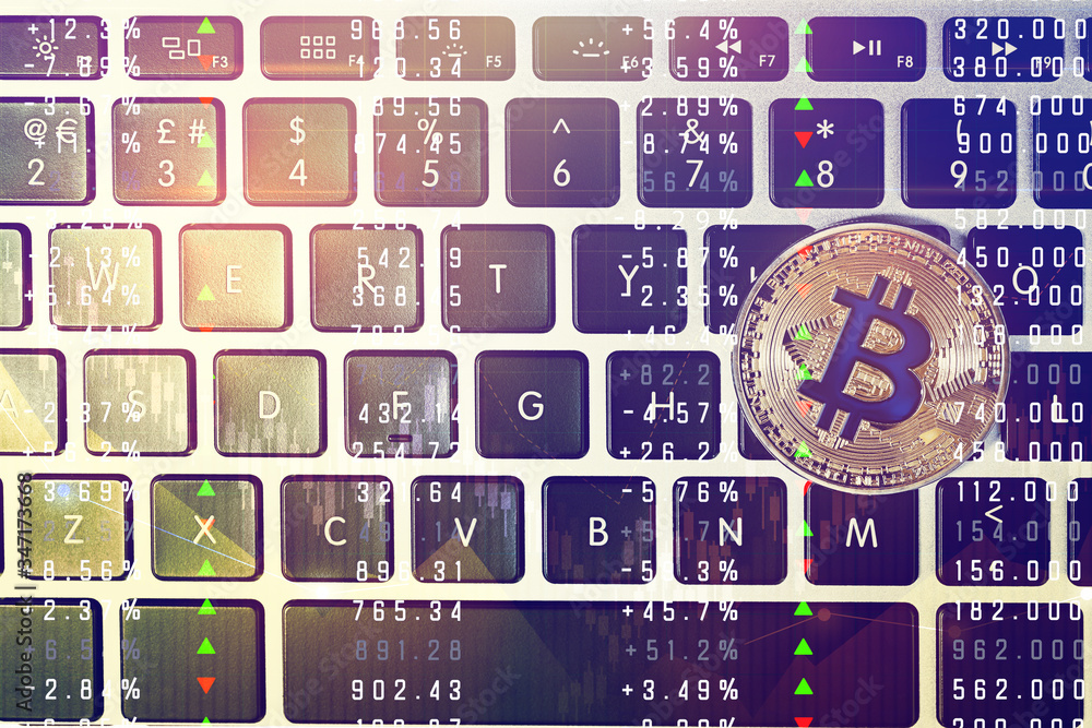 Aufkleber golden bitcoin on computer keyboard, top view