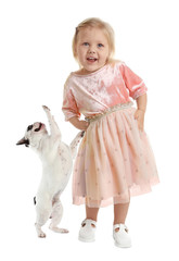 Cute little girl with her pet on white background