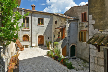 A narrow street between old buildings in the medieval town of Cusano Mutri, in the province of Avellino