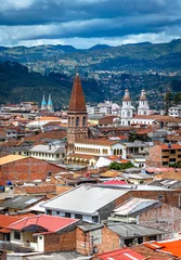 Foto op Canvas View of the city of Cuenca, with it's many churches, cathedrals and houses, in the middle of the Ecuadorian Andes, on a sunny afternoon, Ecuador, South America. © alanfalcony