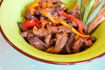 fried beef with vegetables bell peppers and tarragon