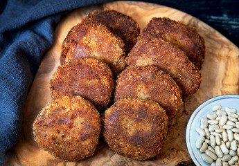 Bean patties or cutlets on a wood board background. Top view