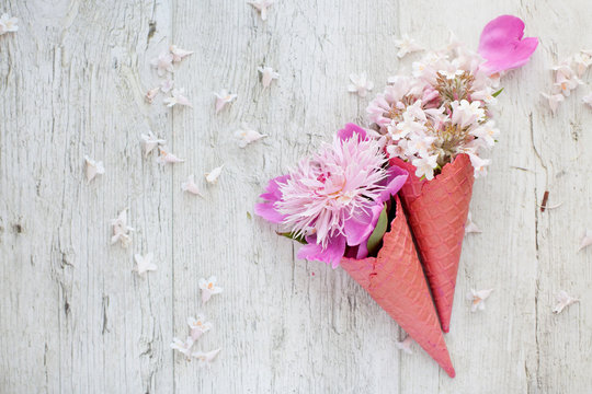 Bouquet - flower ice cream. Pink flowers in an ice cone