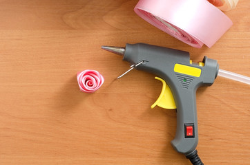 Step by step instruction. Rosette made of satin ribbon. Handmade crafts. Peach background. Pink colors, pink ribbons. Creation. Diy flowers from ribbon, fabric. Step 10