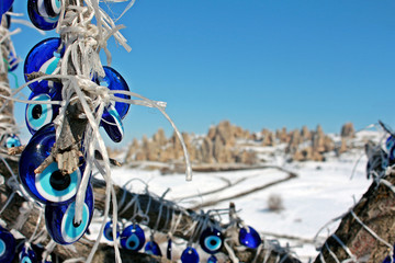 Evil eye bead hanging on tree