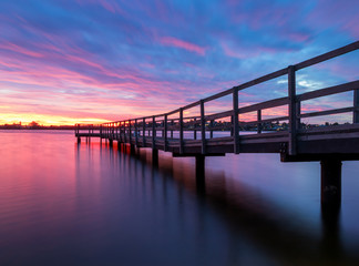 Plakat Bridge Over River Against Sky During Sunset