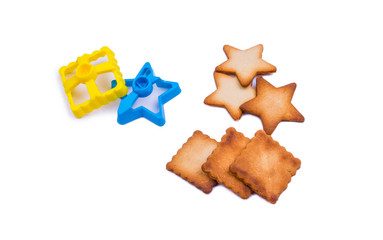 homemade baking dishes and cookies in the form of squares and stars