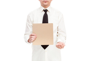 businessman in shirt with a tie holds a cardboard poster protesting unemployment due to quarantine...