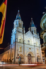 San Alfonso church at night, illuminated, with it's towers and beautiful colors. Cuenca, Ecuador, South America.