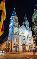 San Alfonso church at night, illuminated, with it's towers and beautiful colors. Cuenca, Ecuador, South America.