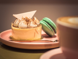 Dessert with macaroon on the plate