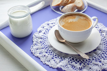 Breakfast served on lavender bed tray, yoghurt,  bread, coffee
