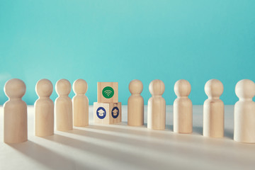 Online education. E-learning. Distance learning. On-line training, webinar. Wooden figures, cubes with cap, wifi signs