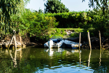 Boats at shoreline in Danube Delta, Romania