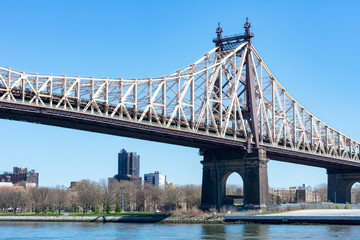 The Queensboro Bridge over the East River with a view of Long Island City Queens New York