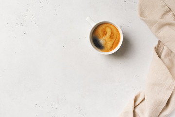 Obraz na płótnie Canvas Cup of coffee espresso on white background with tablecloth, minimal